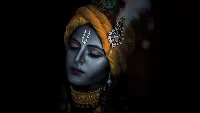 Lord Krishna calm face peacock feather on head 4k wallpaper